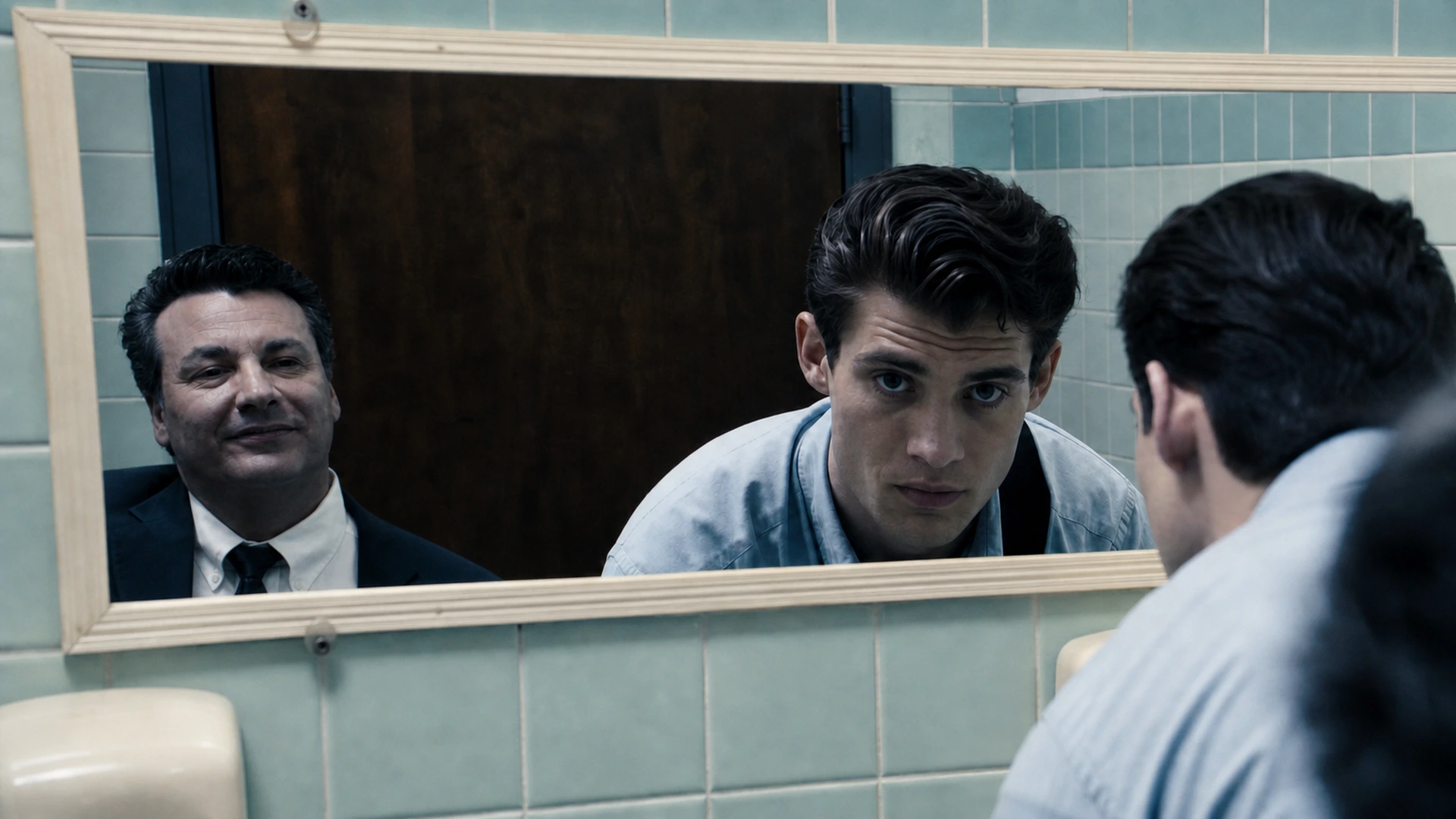 Richard Strauss as Jerry Todd and David Corenswet as Michael Lawson reflected in a mirror in Affairs of State